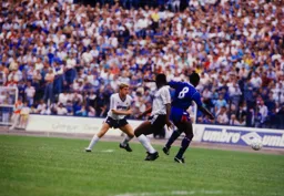 Gary Cobb watches as Emeka Nwajiobi tussles for the ball against Clive Wilson