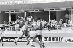 Mike Newell pressures the Arsenal defence