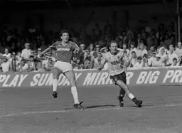 Mick Harford lobs the keeper from 25 yards for the Hatter's 5th