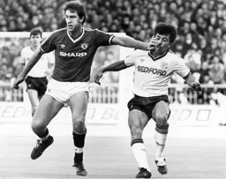Norman Whiteside keeps Rob Johnson at arms length