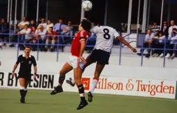 Brian Stein and Bryan Robson go up for a header