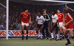 Brian Stein and Ricky Hill wait for a corner to be taken