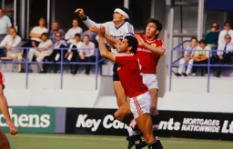 Steve Foster is outnumbered as he waits for the ball to drop
