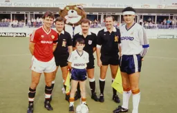 Steve Foster with Bryan Robson, the match officials and mascot prior to the kick off.
