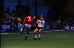 Micky Weir braces himself as Colin Gibson clears the ball