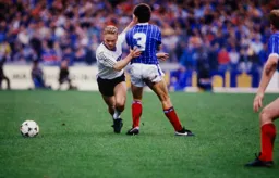 Micky Weir takes the ball past Paul Hardyman
