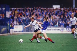 Micky Weir tussles for the ball against Mick Kennedy