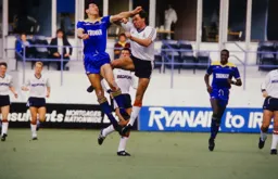 Arms everywhere as Mal Donaghy clashes with a Dons defender