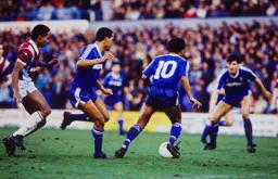Luton players surround the ball