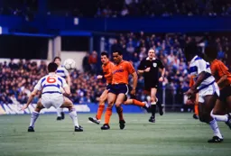 Brian Stein attempts to lob the ball over Gavin Maguire