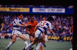 Brian Stein plays the ball away from Martin Allen and Warren Neill