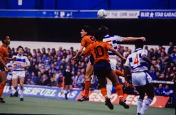 Mick Harford and Alan McDonald rise for a header