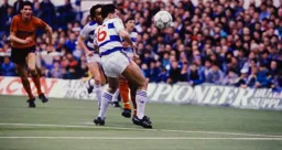 Mick Harford watches the ball as it heads towards the goal