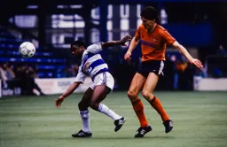 The ball gets away from Paul Parker and Mick Harford