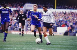 Brian Stein has two defenders in hot pursuit