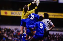 Mick Harford can only watch as Dave Beasant safely catches the ball