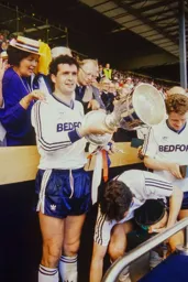 Steve Foster drops the lid which Mick Harford retrieves