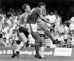 Mick Harford goes for goal