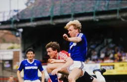 David Oldfield leaps above Russell Osman