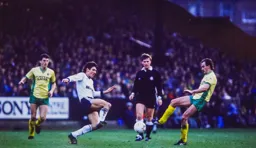 Mick Harford goes for a fifty fifty ball against Mike Phelan