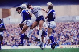 Mick Harford goes for the ball with David Oldfield in support