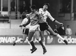 John Dreyer competes for the ball with Wayne Clarke