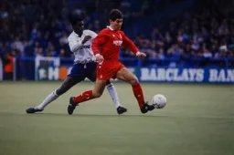 Nigel Clough shields the ball from Marvin Johnson