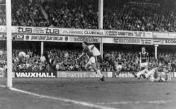 Mick Harford wheels away as the ball heads towards the net