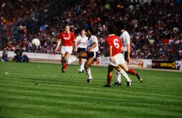 Ricky Hill plays the ball out wide