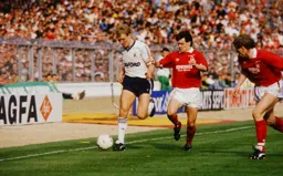 Tim Breacker is trapped on the touchline by Steve Hodge and Stuart Pearce