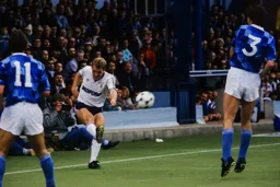 Tim Breacker sends in a cross