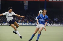 Mick Harford shoots into the back of Mark Wright
