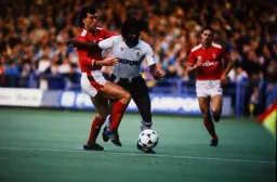 Peter Shirtliff goes in to tackle Ricky Hill