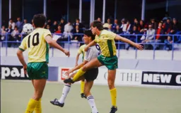 Ian Butterworth heads the ball away from Mick Harford