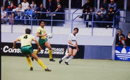 Roy Wegerle crosses the ball before Robert Rosario can intervene