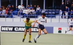Mick Harford looks on as Robert Rosario heads the ball clear