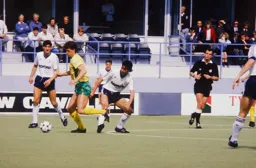 The ball runs away from Roy Wegerle