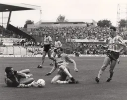 Lars Elstrup challenges for the ball