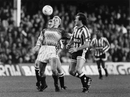 Iain Dowie brings the ball under control on his chest