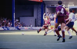 The unknown leg sliding the ball towards the City goal