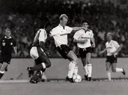 Iain Dowie controls the ball under pressure from David Rocastle
