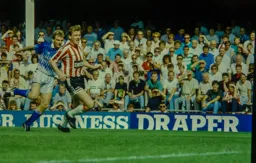 Lars Elstrup sends the ball crashing into the Saints net