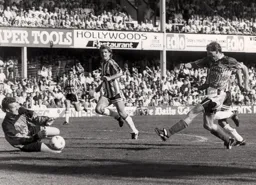 Tim Flowers gets down to save a close range shot from Lars Elstrup