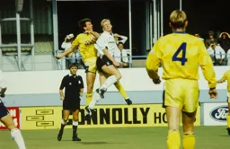 Iain Dowie gliding a header towards goal