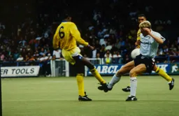 Iain Dowie make contact with the Leeds defender Chris Whyte