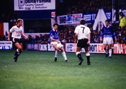 John Dreyer looking to control the ball watched on by Richard Harvey