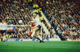 Iain Dowie in a strong challenge with Steve Staunton