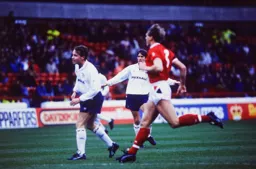 Kingsley Black gets rid of the ball before Stuart Pearce arrives