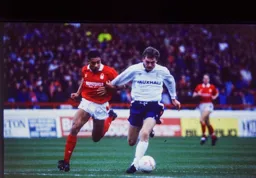 Lars Elstrup gets the beating of Des Walker