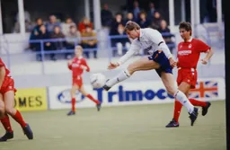 Lars Elstrup fires in a shot watch by Gary Parker